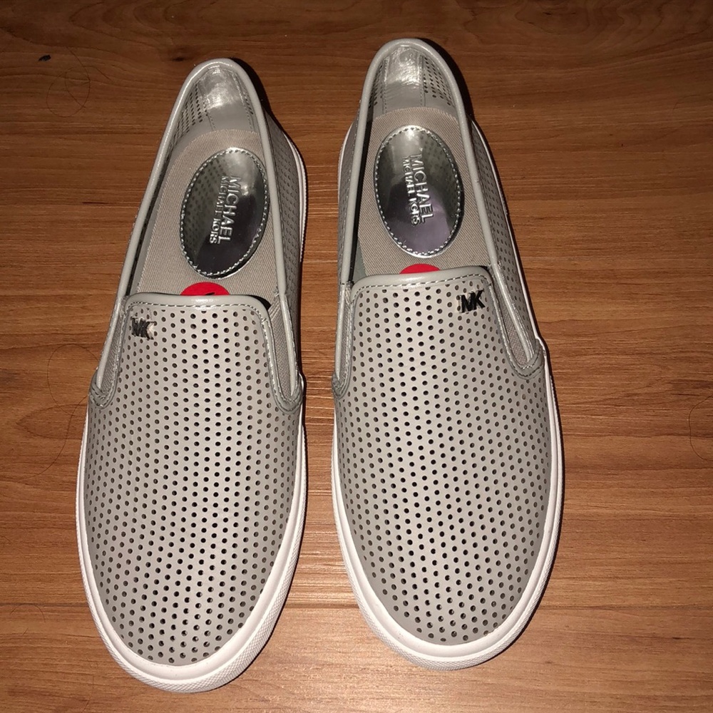 Size 6 light grey Michael kors slip on shoes